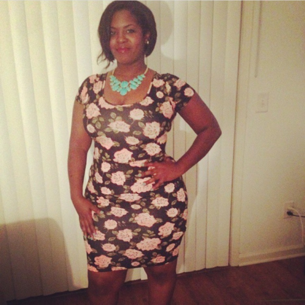 Black and pink fitted flower print dress.